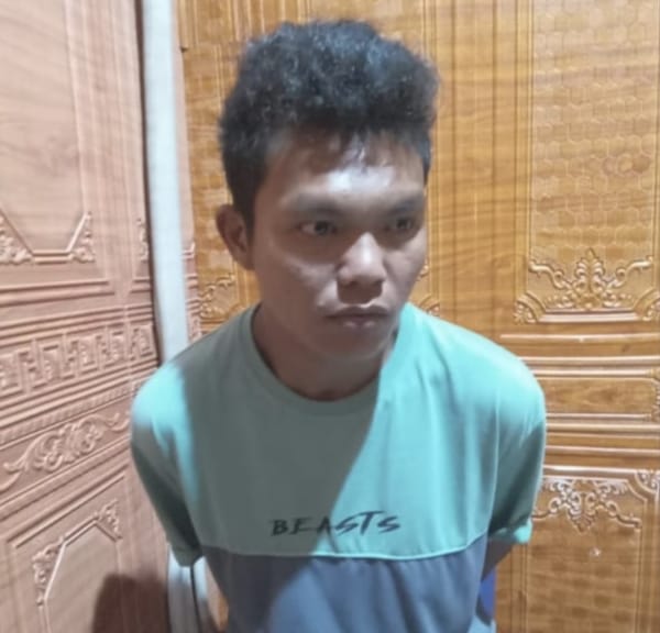 Caption Poto : Tersangka Indra Saputra saat diamankan di Mapolres Empat Lawang